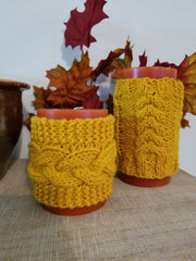 These decorative cozies are to be used with flameless candles only and are made to fit a 3 inch round candle. With the same candle, change the cozy for various holidays & seasons or match your room decor! Two individual sizes and many different colors available - Large is approximately 5 inches tall, small is approximately 3 inches tall Use the code "Candle Cozy Set" at checkout to receive $1 off the purchase of two or more items.